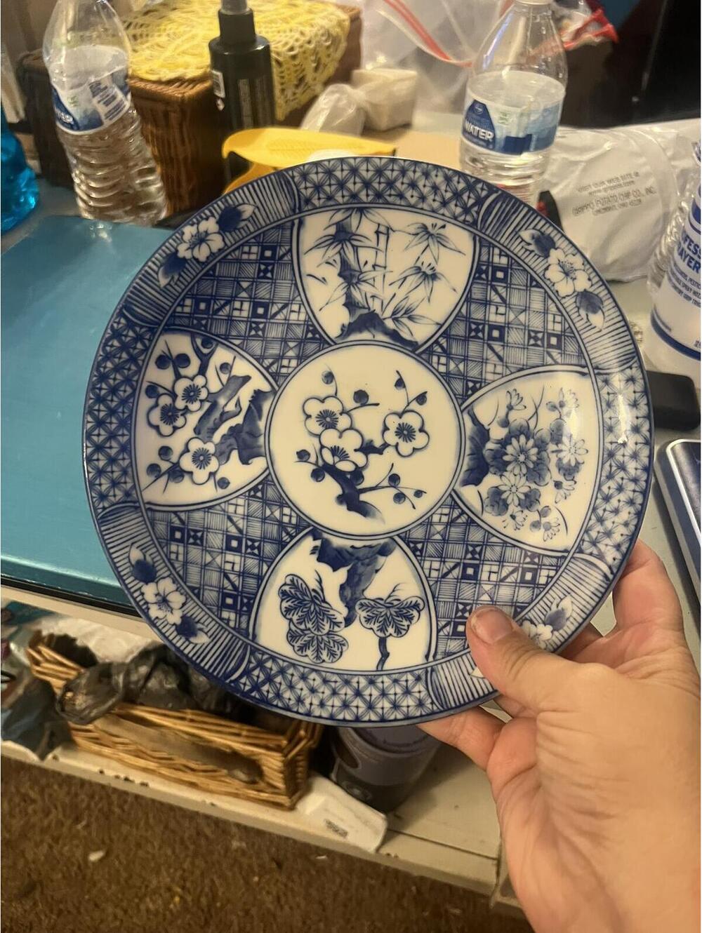 Blue and White Decorative Porcelain Plate with Floral and Butterfly Design